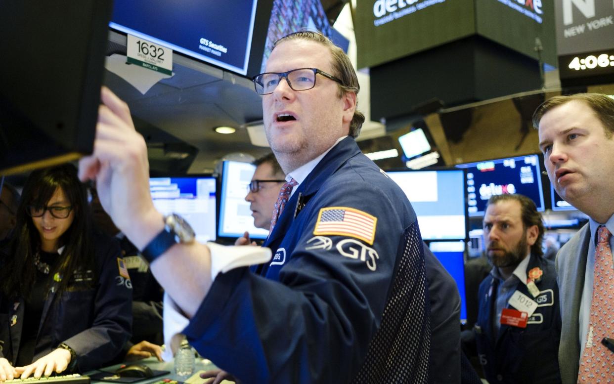 Traders work on the floor of the New York Stock Exchange in New York - JUSTIN LANE/EPA-EFE/REX