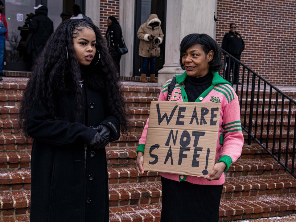 Funeral attendees stand outside the Memphis church.