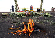 FILE PHOTO: Candle flames burn during a commemoration ceremony for the victims at the scene of the Ethiopian Airlines Flight ET 302 plane crash, near the town Bishoftu, near Addis Ababa, Ethiopia March 14, 2019. REUTERS/Tiksa Negeri