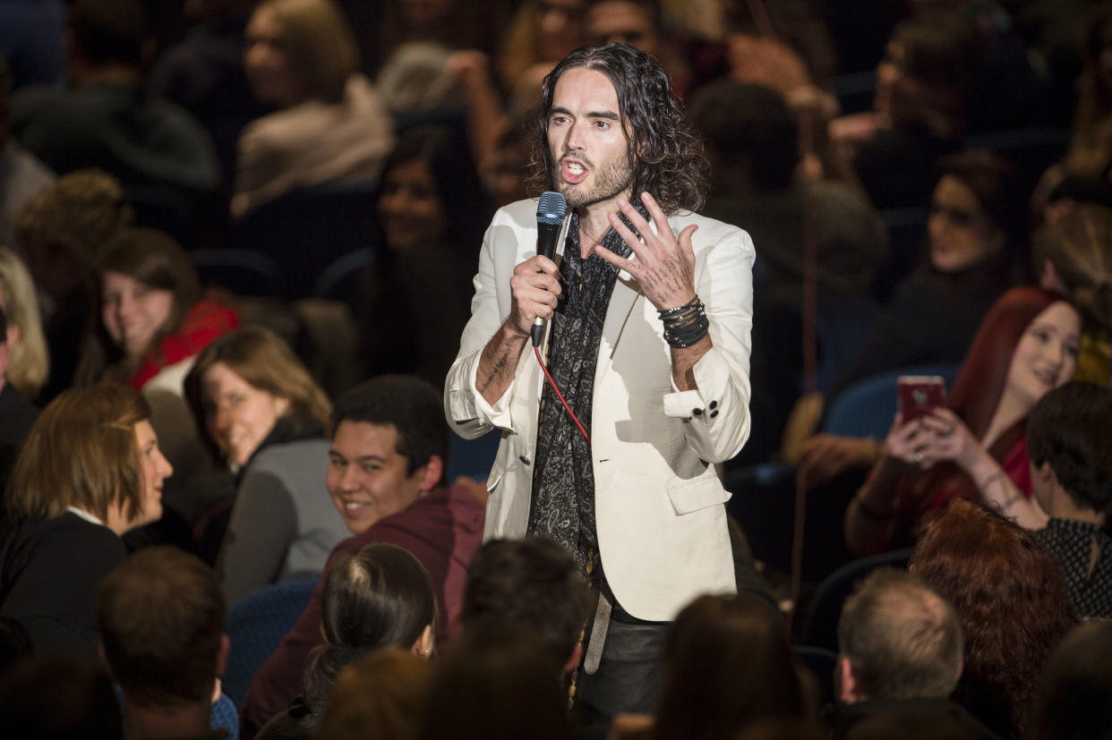 FRANKFURT AM MAIN, GERMANY - FEBRUARY 09:  Russell Brand performs live on stage during his 'Messiah Complex' tour at Jahrhunderthalle on February 9, 2014 in Frankfurt am Main, Germany. Next gigs are planned in Cologne and Berlin. Various characters from society and religion are taken critically-comic under the microscope and compared their life together.  (Photo by Thomas Lohnes/Getty Images)