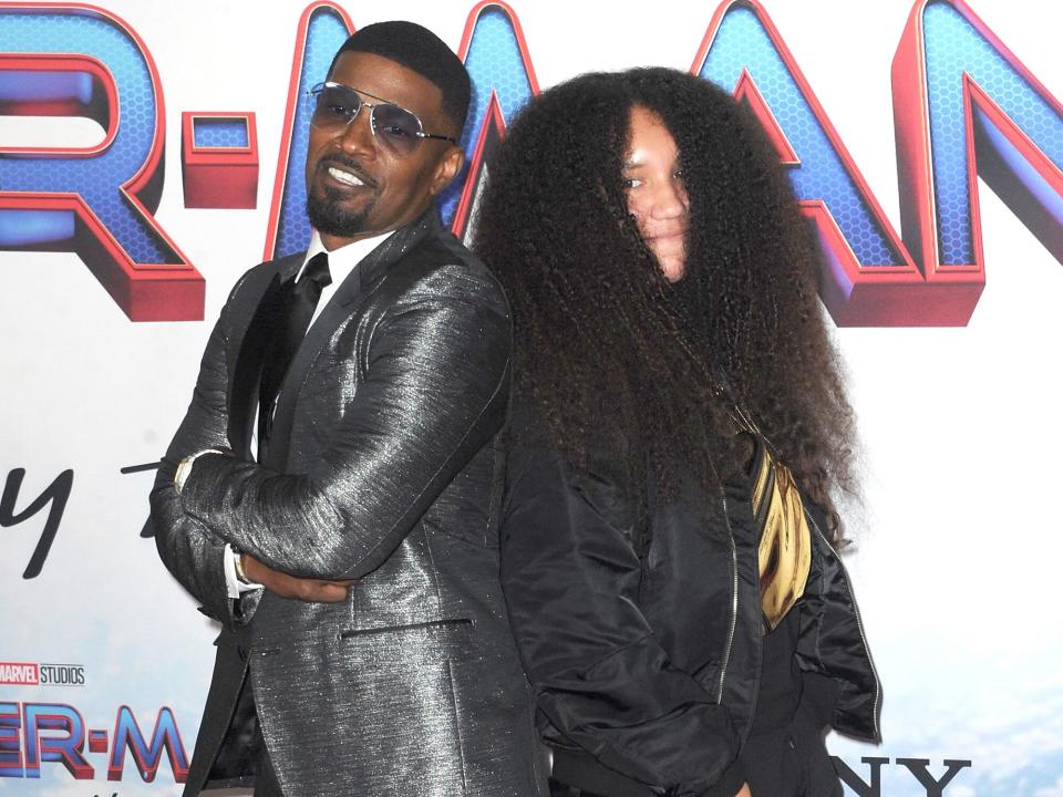 Jamie Foxx and daughter Annalise Foxx attend Sony Pictures' "Spider-Man: No Way Home" Los Angeles Premiere held at The Regency Village Theatre on December 13, 2021 in Los Angeles, California