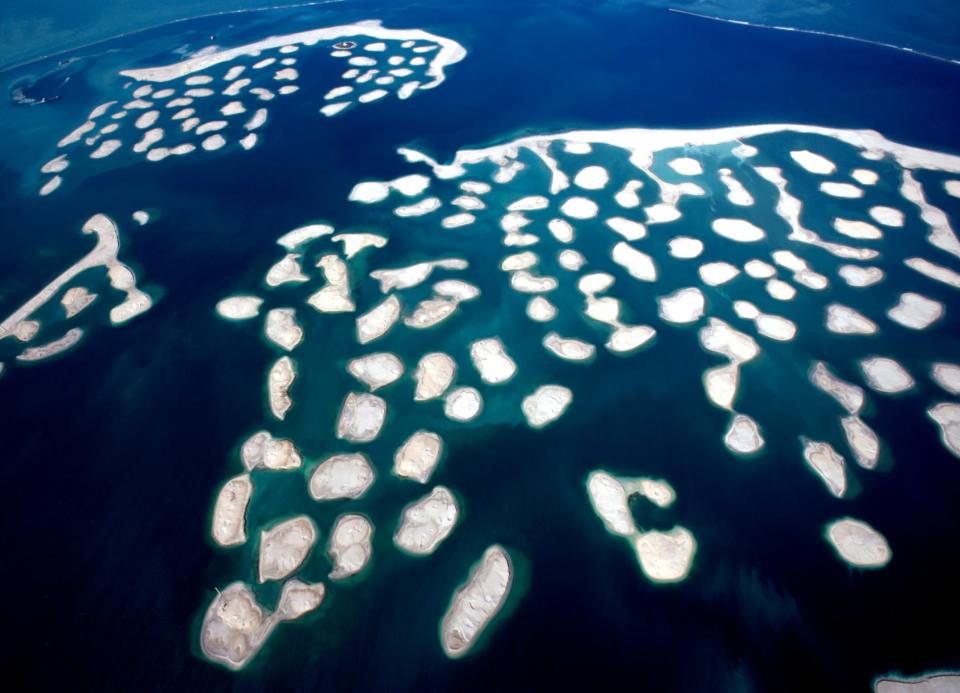 Kumar Wednesday laid the foundation for Bihar's first multi-storeyed industrial complex at the Fatuha industrial area near Patna. At a function on the occasion, he said Contractor had come up with a layout to develop land full of sand near the Ganges. (Pictured left: An aerial view of the man-made The World islands in Dubai, UAE)