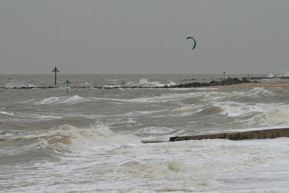 Wind surfers on the sea as they take advantage of strong winds near Clacton-on-Sea (AP)