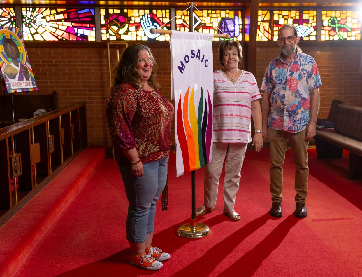 The Rev. Glenda Skinner-Noble, Susan Humphrey and the Rev. Scott Spencer stand in the sanctuary of  Mosaic United Methodist Church in Oklahoma City.