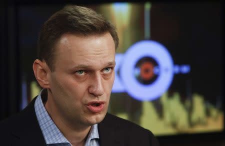 Russian opposition leader Alexei Navalny speaks in the studio of the radio station Echo of Moscow in Moscow, Russia December 27, 2017. REUTERS/Sergei Karpukhin