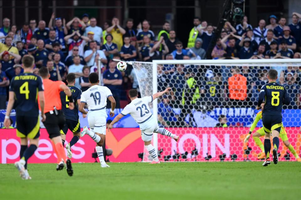 Xherdan Shaqiri sends the ball towards the top corner (Getty Images)