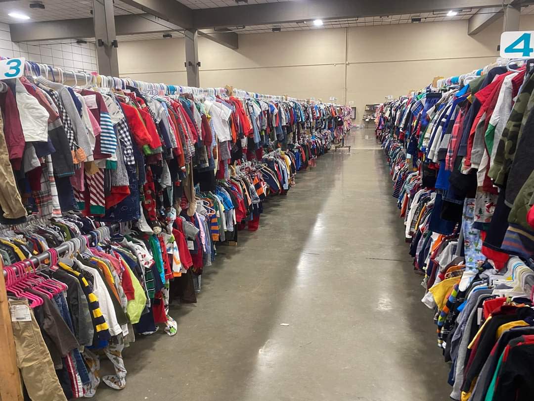 Rows of children's clothing on sale at the One Week Boutique sale.