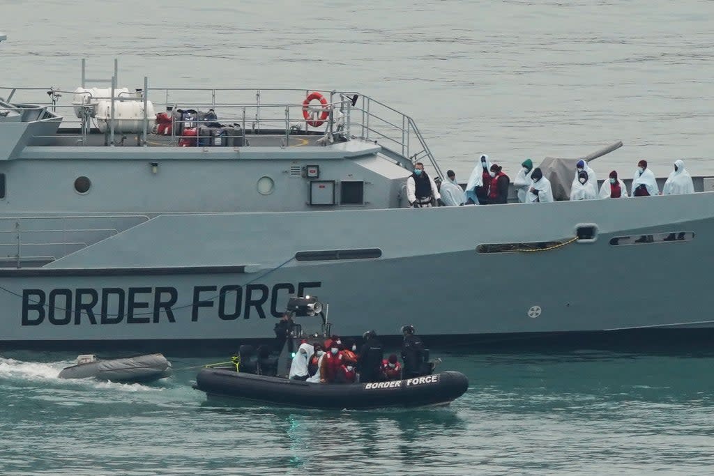 A group of people thought to be migrants are brought in to Dover, Kent, by Border Force officers (Gareth Fuller/PA) (PA Wire)