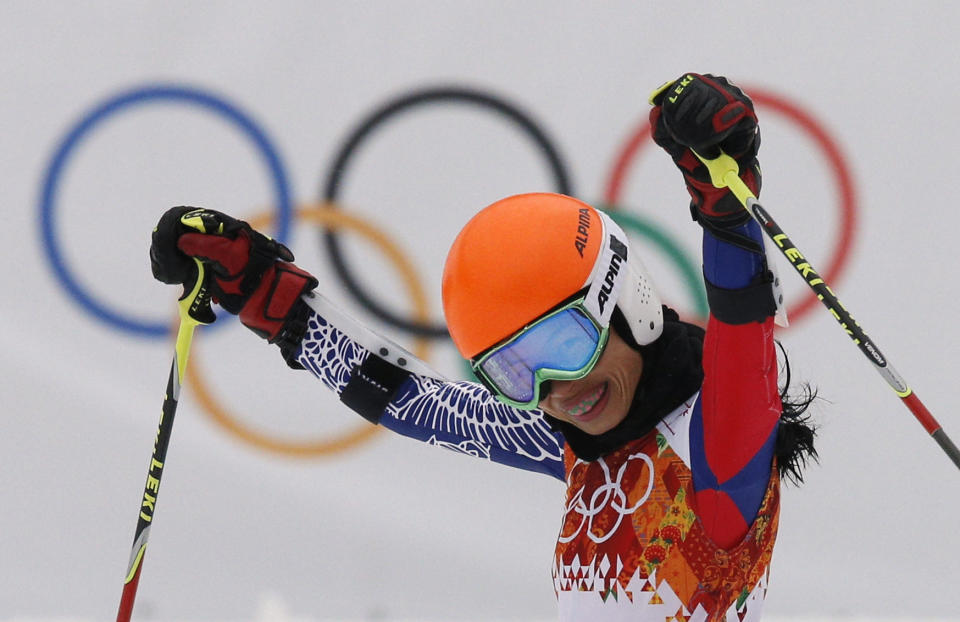 Violinst Vanessa Mae starting under her father name as Vanessa Vanakorn for Thailand celebrates after completing the first run of the women's giant slalom at the Sochi 2014 Winter Olympics, Tuesday, Feb. 18, 2014, in Krasnaya Polyana, Russia.(AP Photo/Christophe Ena)