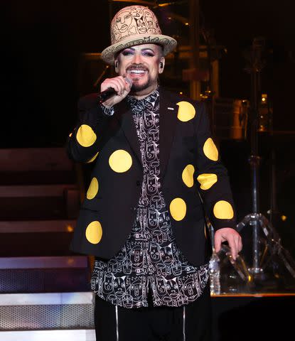 <p>Jason Kempin/Getty Images</p> Boy George performs with Culture Club in July 2023