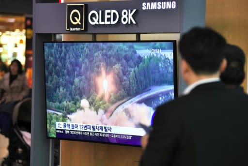 South Koreans watch footage of a North Korean missile launch shown at a railway station in Seoul in October 2019