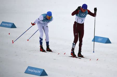 Cross-Country Skiing - Pyeongchang 2018 Winter Olympics - Men's 50km Mass Start Classic - Alpensia Cross-Country Skiing Centre - Pyeongchang, South Korea - February 24, 2018 - Alexander Bolshunov, Olympic athlete from Russia, and Iivo Niskanen of Finland compete. REUTERS/Carlos Barria