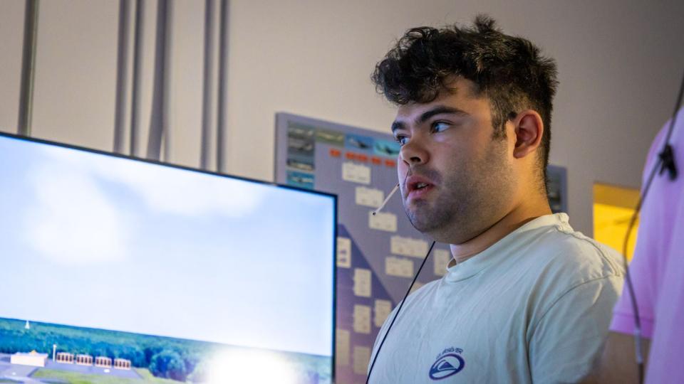 Alejandro Jaramillo guides a virtual plane toward a runway during air traffic control training at Embry-Riddle Aeronautical University in May, 2024.