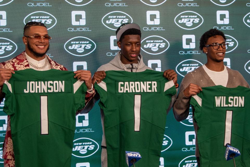 The New York Jets' first-round picks Jermaine Johnson, Ahmad "Sauce" Gardner and Garrett Wilson are introduced at a press conference.