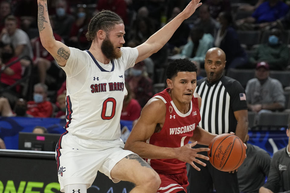 Wisconsin guard Johnny Davis drives on St. Mary's guard Logan Johnson (0) in the first half during an NCAA college basketball game at the Maui Invitational in Las Vegas, Wednesday, Nov. 24, 2021. (AP Photo/Rick Scuteri)