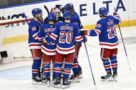 New York Rangers goaltender Igor Shesterkin, third from left, celebrates with teammates after they shut out the Ottawa Senators in an NHL hockey game Monday, April 15, 2024, at Madison Square Garden in New York. (AP Photo/Bill Kostroun)