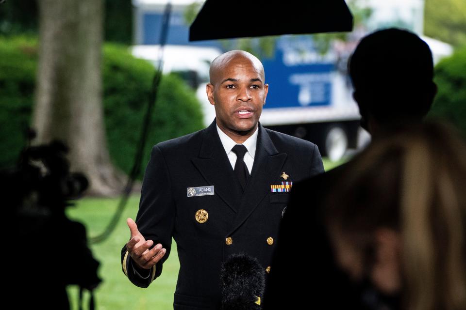 Surgeon General Jerome Adams during a TV interview at the White House on Tuesday. (The Washington Post via Getty Images)