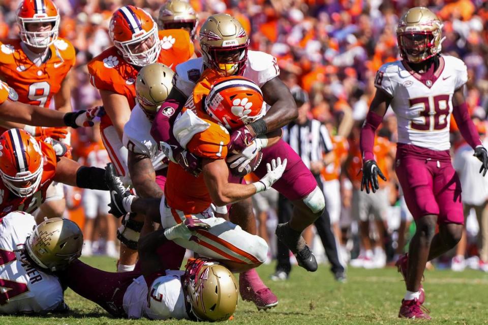 Sep 23, 2023; Clemson, South Carolina, USA; Clemson Tigers running back Will Shipley (1) is tackled by Florida State Seminoles linebacker Tatum Bethune (15) in the second half at Memorial Stadium. Mandatory Credit: David Yeazell-USA TODAY Sports