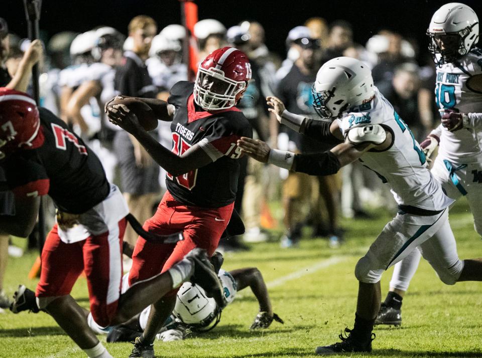 Dunnellon quarterback Dylan Curry (15) carries the ball down near the goal line in first-half action at Dunnellon Aug. 26, 2022.