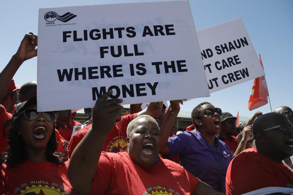 Members of the South African Cabin Crew Association and the National Union of Metalworkers of South Africa members picket at the SAA Airways Park in Kempton Park, South Africa, Friday, Nov. 15, 2019. South Africa's troubled state-owned airline has begun canceling flights after two unions announced their workers would go on strike to protest nearly 1,000 expected job cuts. (AP Photo/Themba Hadebe)