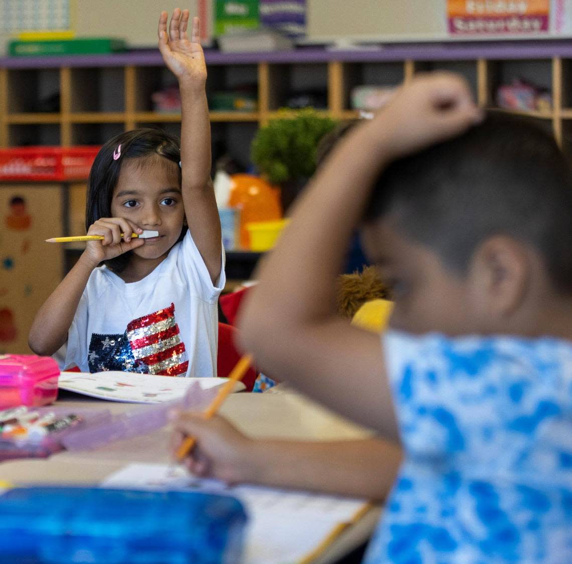 Weatherstone Elementary School first grader Rishika Roy raises her hand with a question during spelling instruction in Jennifer Ivarsson’s class on Friday, September 16, 2022 in Cary, N.C.