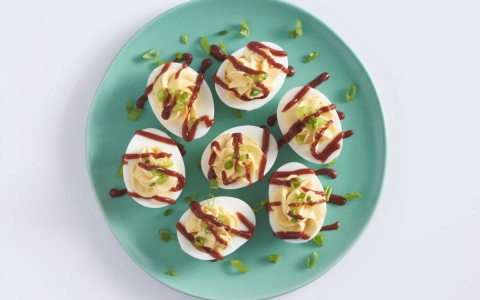 <p>Mark Boughton Photography</p><p>These BBQ deviled eggs are a quick, easy addition to your game-day lineup. Barbecue sauce lends these easy deviled eggs a smoky-sweet flavor.</p><p><strong>Get the recipe: <a href="https://parade.com/1080537/parade/bbq-deviled-eggs-recipe-john-wayne/" rel="nofollow noopener" target="_blank" data-ylk="slk:BBQ Deviled Eggs;elm:context_link;itc:0;sec:content-canvas" class="link ">BBQ Deviled Eggs</a></strong></p>