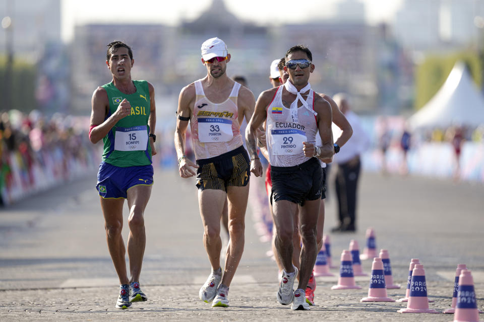 Brazil's Caio Bonfim (15), Spain's Alvaro Martin (33) and Brian Daniel Pintado, of Ecuador (29) lead the pack, during the men's 20km race walk at the 2024 Summer Olympics, Thursday, Aug. 1, 2024, in Paris, France. (AP Photo/Vadim Ghirda)