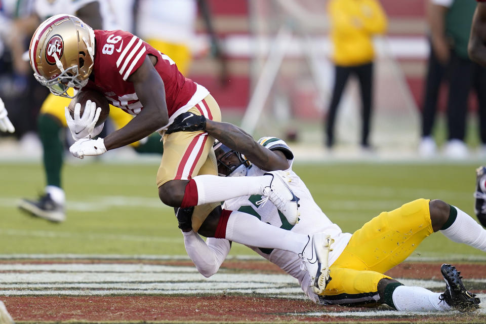 San Francisco 49ers wide receiver Danny Gray (86) runs against Green Bay Packers cornerback Rico Gafford during the first half of an NFL preseason football game in Santa Clara, Calif., Friday, Aug. 12, 2022. (AP Photo/Godofredo A. Vásquez)