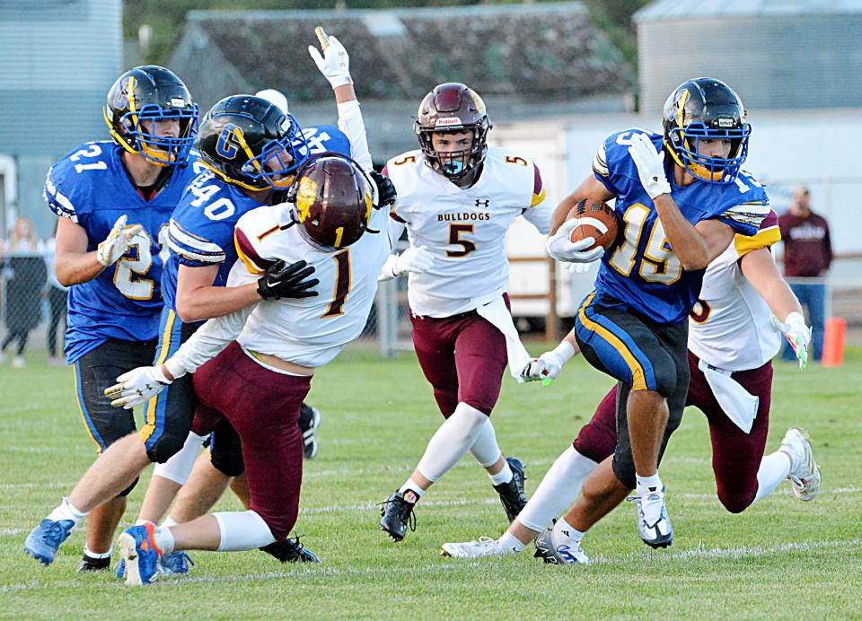 Booker Schooley's (40) block on De Smet's Gannon Gruenhagen (1) helps spring Castlewood's Quincy Thu (15) loose on a 55-yard touchdown run during their season-opening high school football game Friday, Aug. 19, 2022 in Castlewood.,