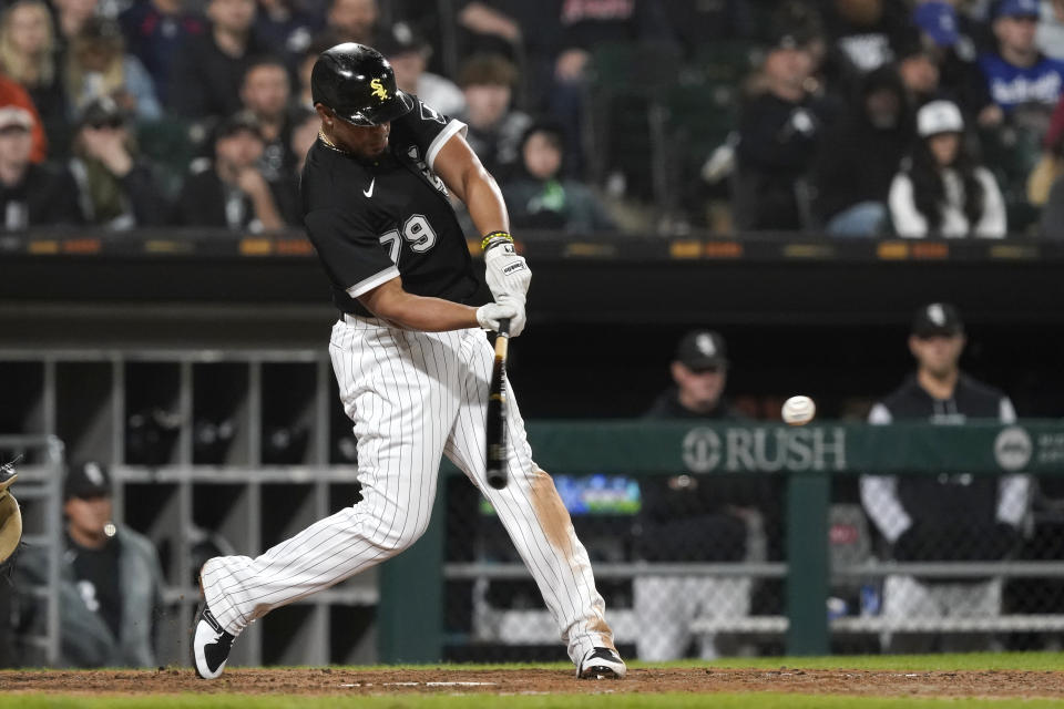 Chicago White Sox's Jose Abreu singles against the Los Angeles Dodgers during the sixth inning of a baseball game Tuesday, June 7, 2022, in Chicago. (AP Photo/Charles Rex Arbogast)