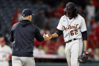 Detroit Tigers starting pitcher Jose Urena, right, gives the ball to manager A.J. Hinch after the Los Angeles Angels had scored five runs during the fifth inning of a baseball game in Anaheim, Calif., Friday, June 18, 2021. (AP Photo/Alex Gallardo)