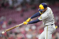 Milwaukee Brewers' Brice Turang hits a double against the Cincinnati Reds during the third inning of a baseball game Tuesday, April 9, 2024, in Cincinnati. (AP Photo/Jeff Dean)