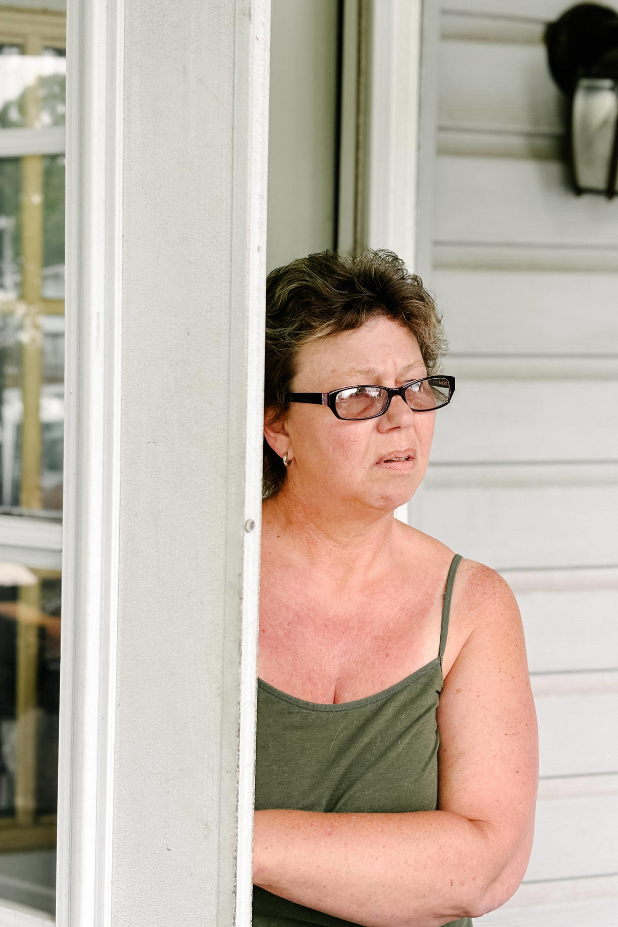 Lisa Holden on her porch. (Micah McCoy for NBC News)