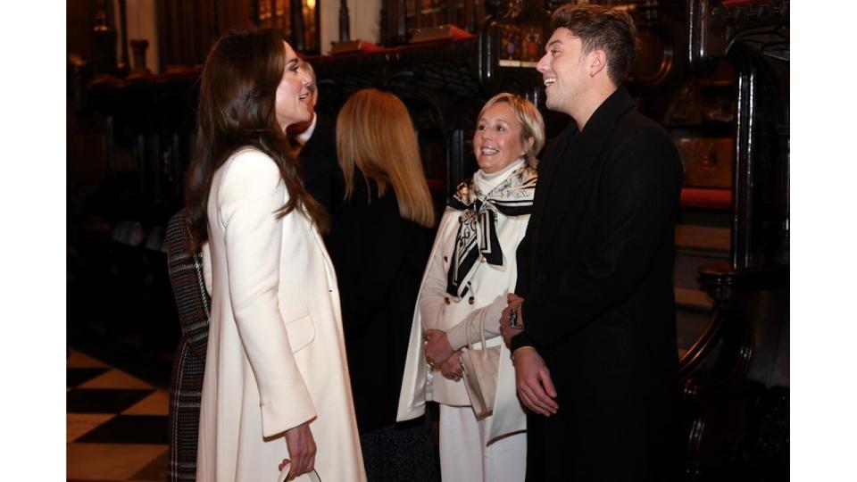 Princess Kate speaks with Roman Kemp at The "Together At Christmas" Carol Service at Westminster Abbey in December 2023