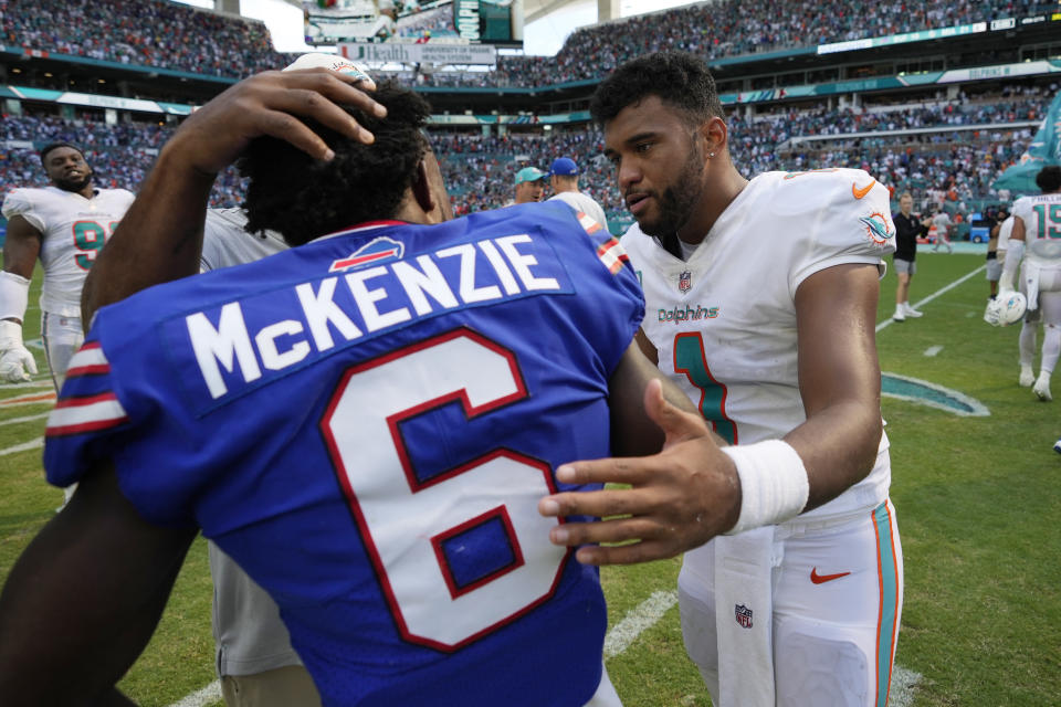 Miami Dolphins quarterback Tua Tagovailoa (1) talks to Buffalo Bills wide receiver Isaiah McKenzie (6) after an NFL football game, Sunday, Sept. 25, 2022, in Miami Gardens, Fla. The Dolphins defeated the Bills 21-19. (AP Photo/Rebecca Blackwell)