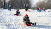 Some took advantage of snowy slopes, including Davina Armitage who sledged at Tatton Park in Knutsford, Cheshire. (PA)