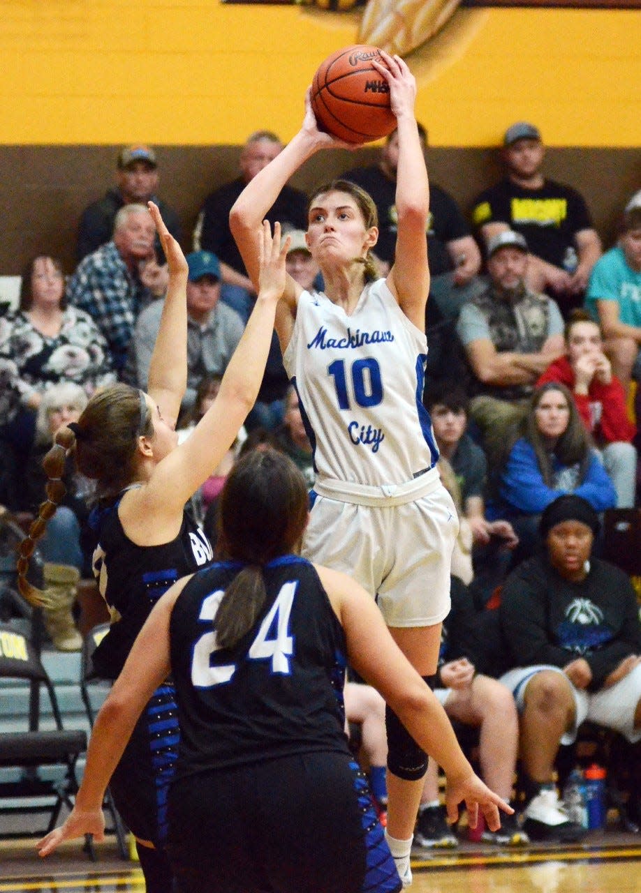 Mackinaw City's Madison Smith pulls up for a jumper and hits it over an Inland Lakes defender during the second half of Thursday's game.