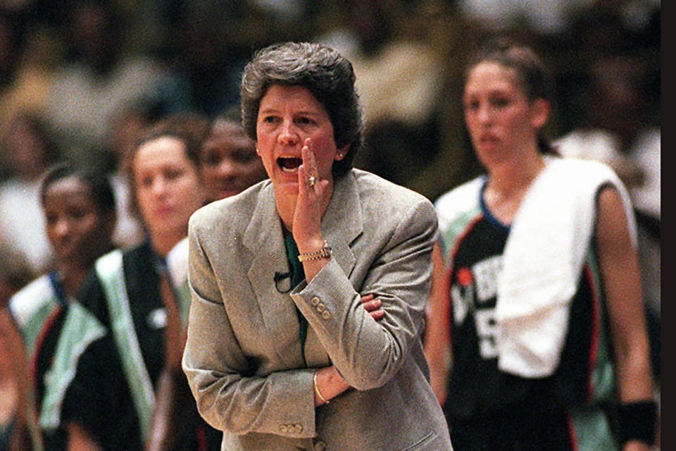 FILE - This is a June 21, 1997, file photo showing New York Liberty coach Nancy Darsch yelling instructions to her players during the inaugural WNBA basketball game, against the Los Angeles Sparks in Inglewood, Calif. The Liberty defeated the Sparks, 67-57. Darsch, who guided the Ohio State women's basketball team to the 1993 title game and went on to coach in the WNBA, died Monday, Nov. 2, 2020, in her hometown of Plymouth, Massachusetts. She was 68.(AP photo/Kevork Djansezian, FIler)