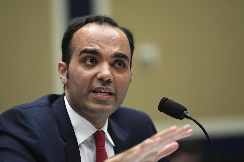 FILE - In this May 8, 2019, file photo, Federal Trade Commission commissioner Rohit Chopra testifies during a House Energy and Commerce subcommittee hearing on Capitol Hill in Washington. In its first move since getting a new director, Rohit Chopra, the Consumer Financial Protection Bureau is ordering Apple, Amazon, PayPal and other tech giants to disclose how they operate their proprietary payment networks, which have to come to dominate large portions of e-commerce and person-to-person payments. (AP Photo/Susan Walsh, File)