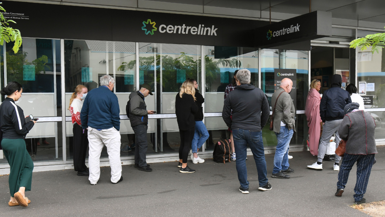 Australians line up outside a Centrelink office.