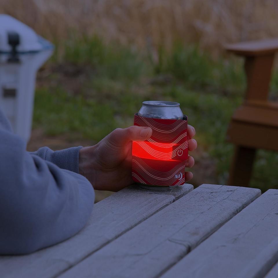 A person holding a can with the wrap on it