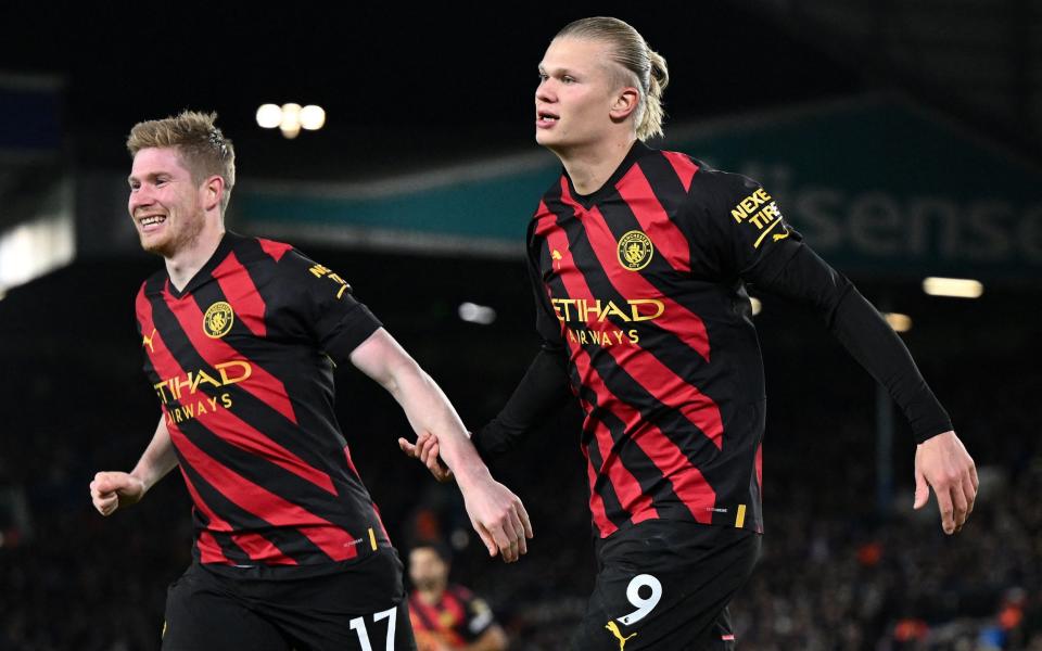 Manchester City's Norwegian striker Erling Haaland (R) celebrates scoring his team's second goal - AFP