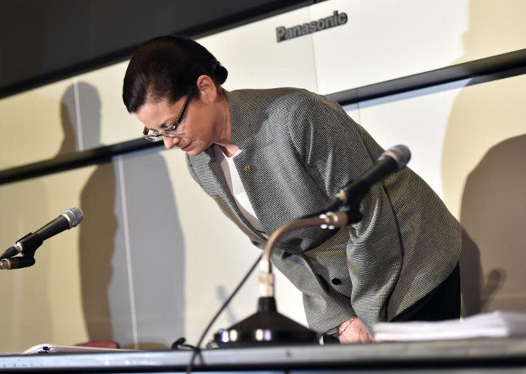 McDonald's Japan president Sarah Casanova bows her head as she announces the company's restructuring plan at a press conference at the Tokyo Stock Exchange on April 16, 2015