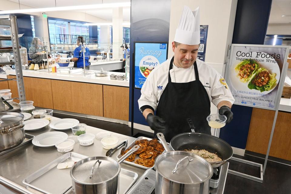 Aramark Collegiate Hospitality Services Chef Mike Wojciechowski prepares a meal of chicken schnitzel, German potato salad and quick sauerkraut in early March at McCallie Dining Hall in the Keathley University Center on the campus of Middle Tennessee State University in Murfreesboro, Tenn. Wojciechowski, who oversees operations at McCallie and Farmers Market Dining Hall in the Student Union, won third place in the Aramark Culinary Excellence Competition held earlier in the spring.