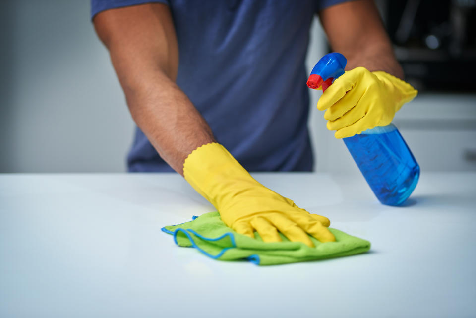 Shot of an unrecognizable man doing household chores