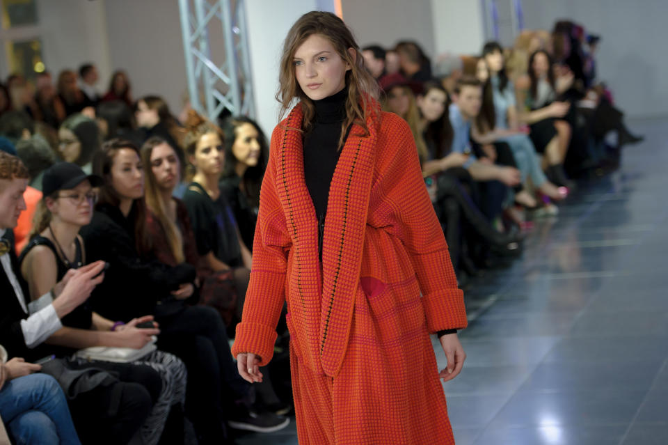 A model wears a design created by Mark Fast during London Fashion Week Autumn/Winter 2014, at Somerset House in central London, Friday, Feb. 14, 2014. (Photo by Jonathan Short/Invision/AP)