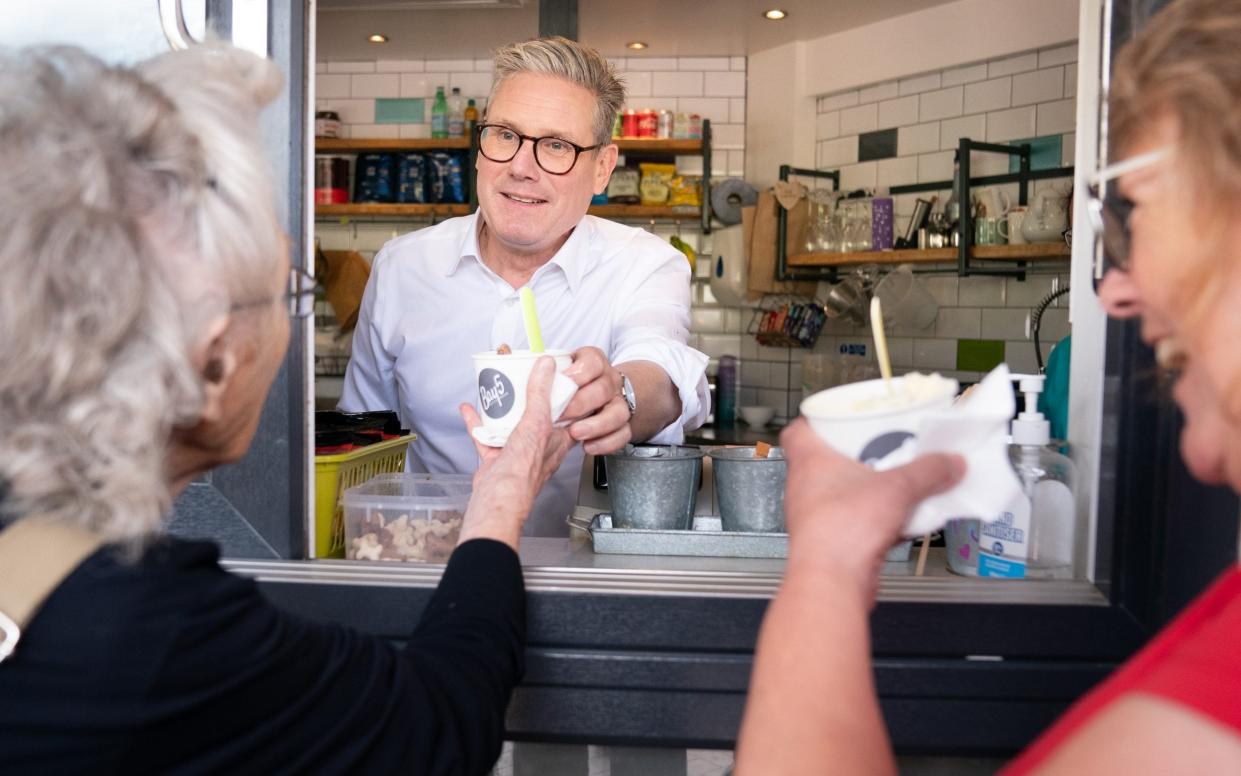 Sir Keir Starmer serves ice cream to day trippers on Barry seafront in South Wales after launching Labour's six steps for change in Wales