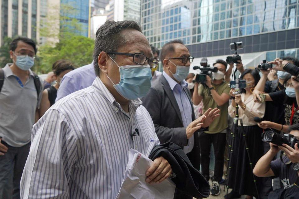 Various defendants including pro-democracy activists, Albert Ho, center, and Yeung Sum, right, arrive at a court in Hong Kong, Monday, May 17, 2021. Trial starts for Jimmy Lai and nine others, accused of "incitement to knowingly take part in an unauthorized assembly" for a protest march on Oct. 1, 2019. The court has estimated 10 days for this trial. (AP Photo/Kin Cheung)