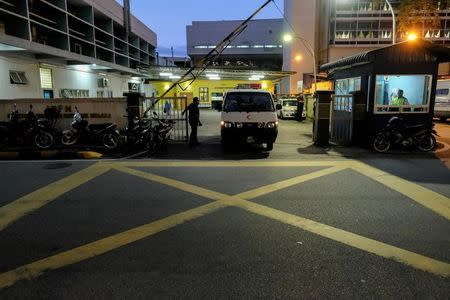 A hospital van leaves the morgue at Kuala Lumpur General Hospital where Kim Jong Nam's body is held for autopsy in Malaysia February 17, 2017. REUTERS/Athit Perawongmetha