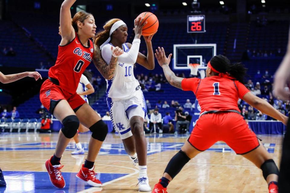 Kentucky’s Rhyne Howard (10) looks to pass the ball while guarded by Mississippi’s Shakira Austin (0) and Lashonda Monk (1) during Sunday’s game at Rupp Arena.